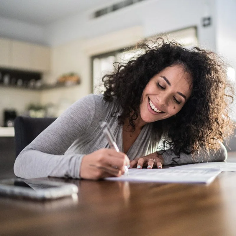 woman-filling-out-certification-form